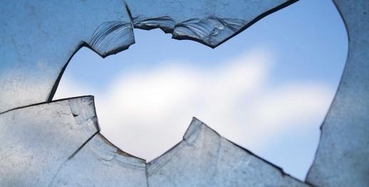 A window broken shown against a blue sky. By Skeeze on Pixabay